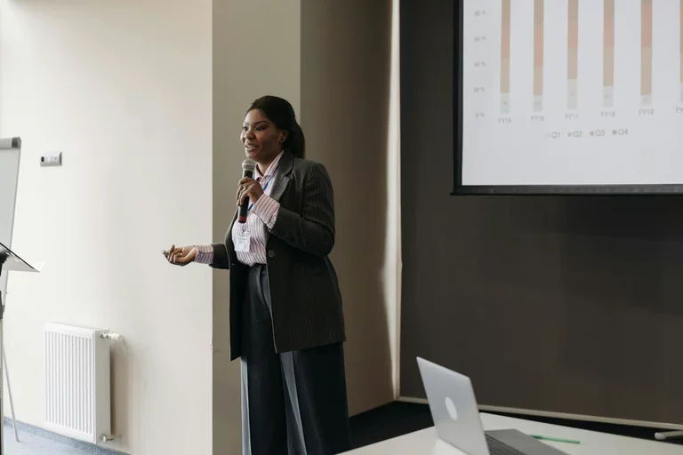 Woman with microphone public speaking