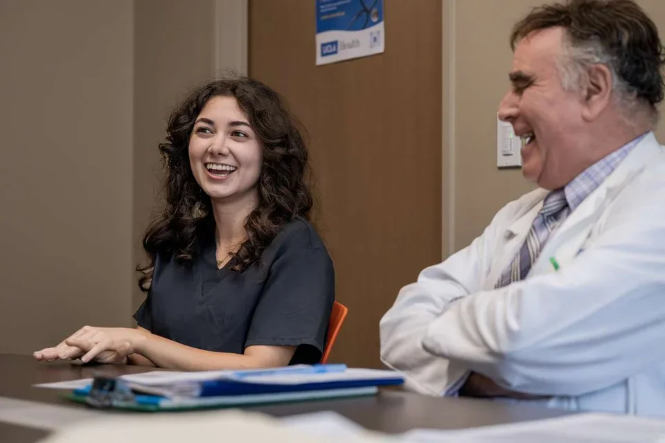 Nazeli Khodaverdyan, Familial Mediterranean Fever Clinic volunteer and fourth-year UCLA student, with Dr. Wayne Grody 