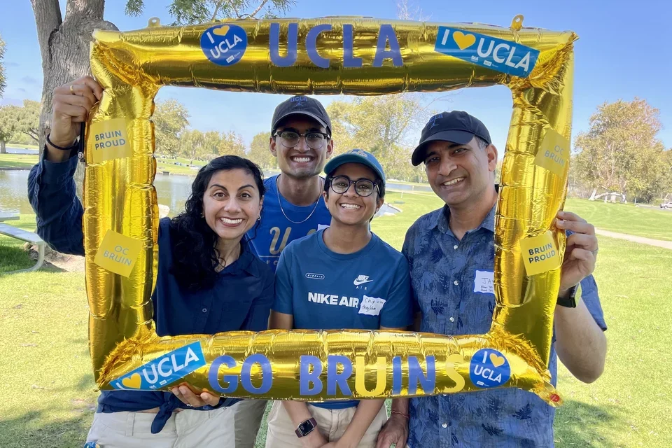 The Agarwal family poses with an inflatable UCLA picture frame