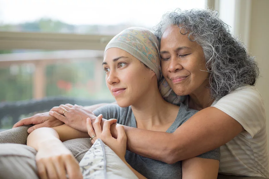 Cancer Metabolism - A mother holding her daughter