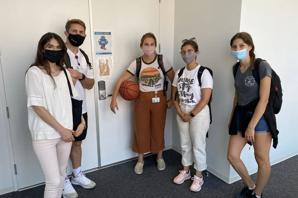 A group of medical students on a team building scavenger hunt in Geffen Hall