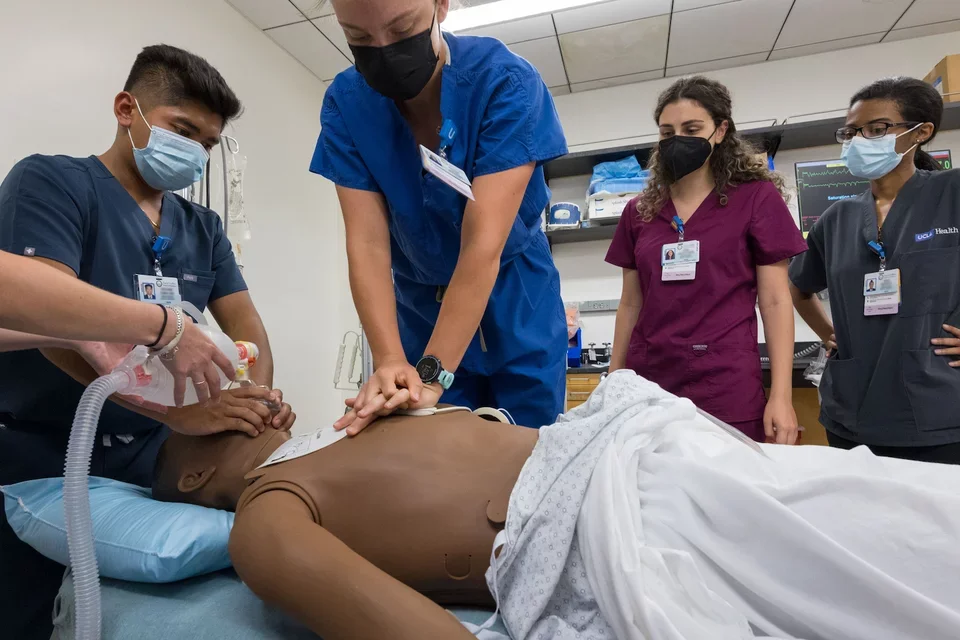 Students working in a simulation center