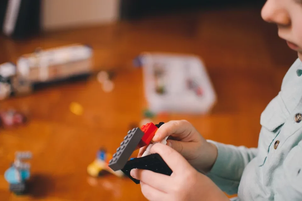 A child playing with building bricks