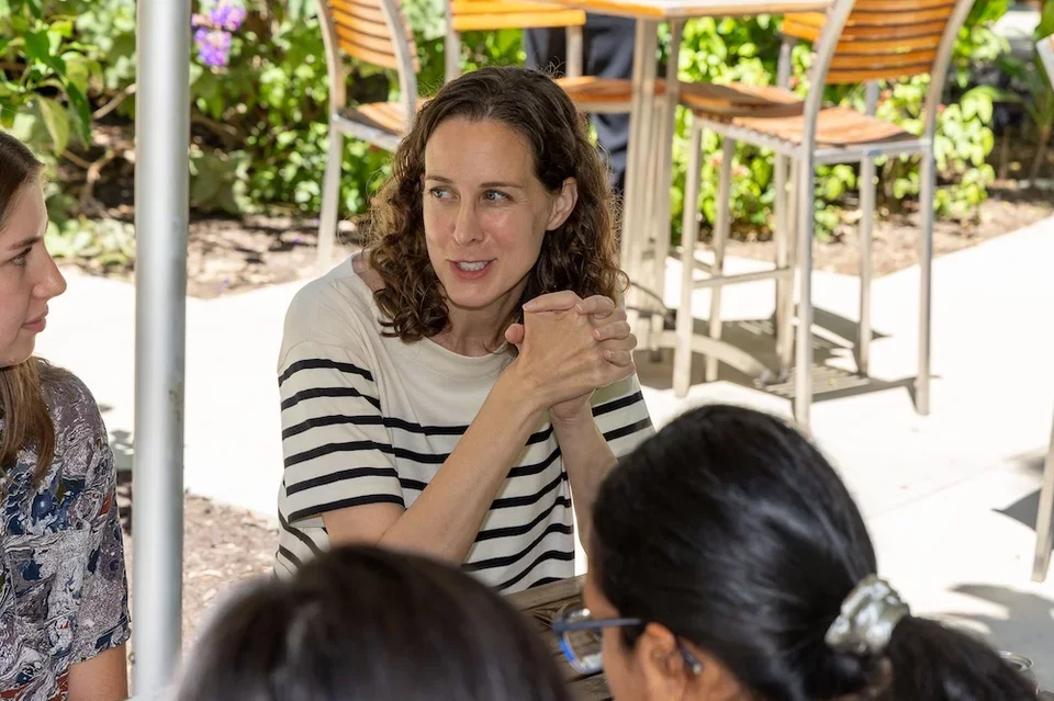 faculty talking with students