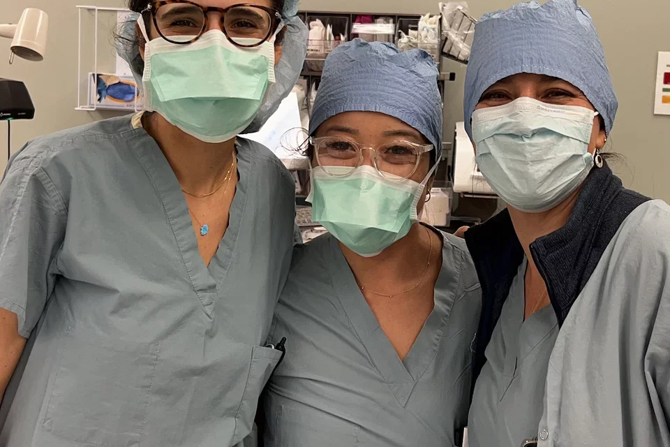 UCLA's Dr. Cecilia Canales, pictured with her colleagues in clinical scrubs and masks, shares her expertise about anesthesia side effects.  