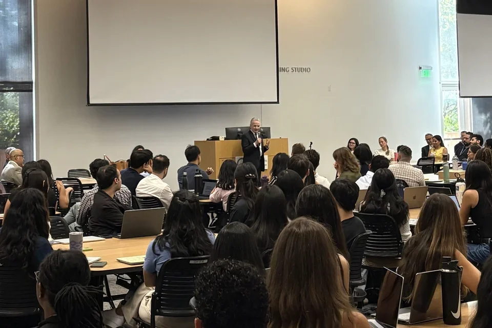 The DGSOM medical school deans addresses a classroom full of incoming medical students