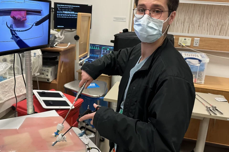 Medical student Eric Smith, pictured completing a surgery training exercise, shares his story of becoming a doctor 