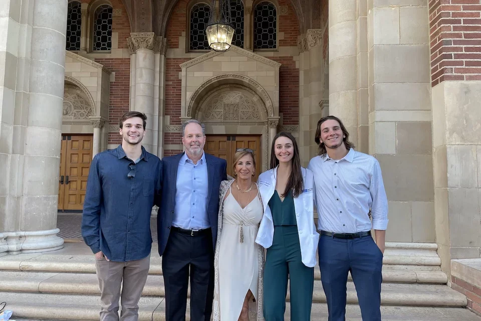 Medical student Mikayla Mefford, pictured here with her family during DGSOM’s White Coat Ceremony, shares her story of becoming a doctor