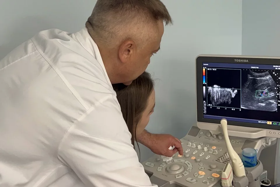 Tereza Vitkovska, pictured with her father, shares her story of becoming a doctor   Caption: Tereza’s father teaching her how to read ultrasound images