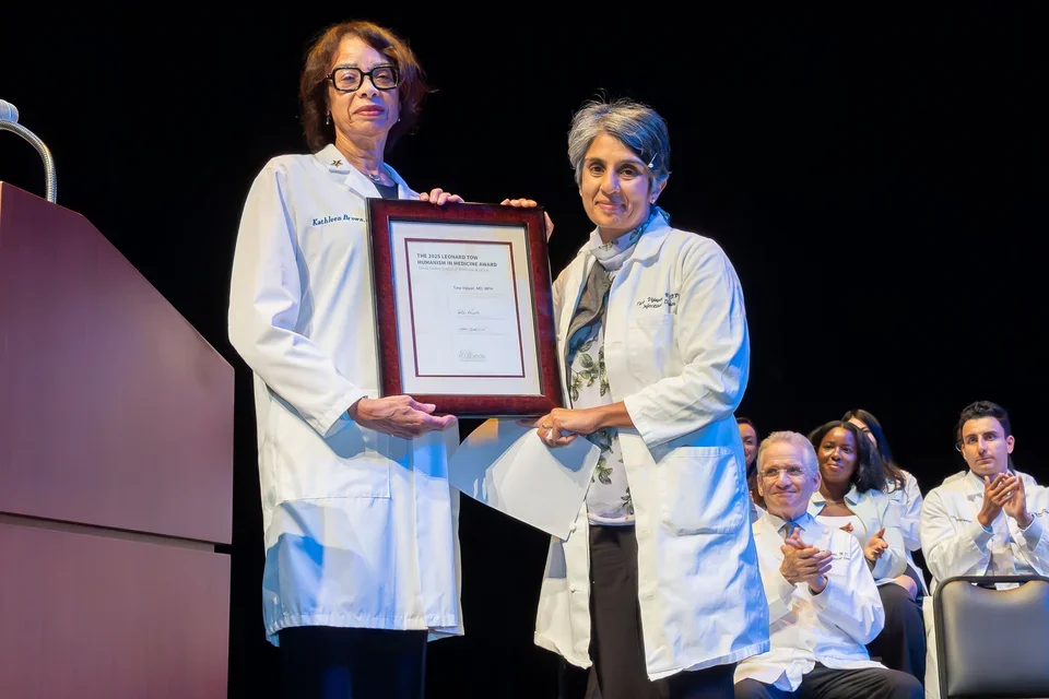 Dr. Brown presenting award to Dr. Vijayan