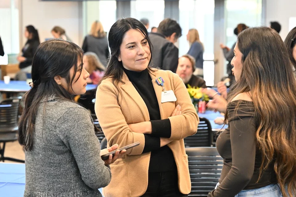 three people talking