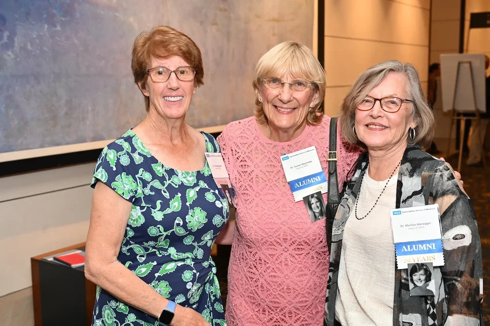 Honoree and alumna Susan Reynolds, MD, stands with fellow alumnae at the Class of 1976’s reunion
