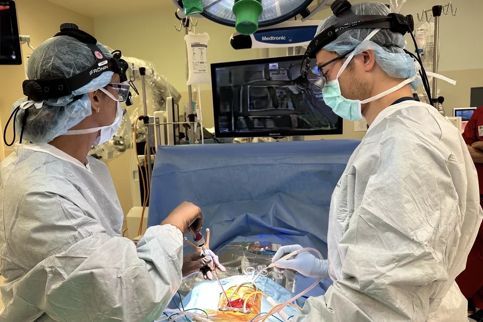 Orthopedic Surgeons Operating on Spinal Cord