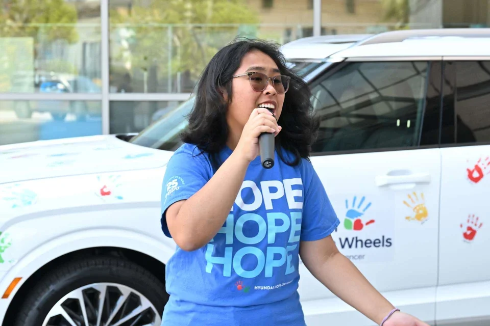 Pediatric cancer survivor Angela Unayan speaks at the Hyundai Hope on Wheels ceremony for pediatric cancer research