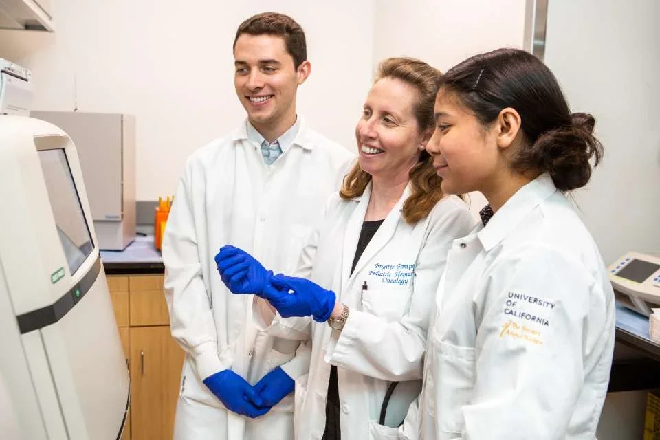 UCLA regenerative medicine researchers wearing their white laboratory coats 