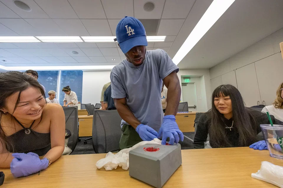 Medical student Samuel Edwards doing a pre-hospital training exercise 
