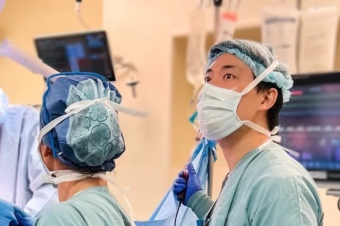 UCLA anesthesiologist Dr. Jason Lee and colleagues in an the operating room, working on a procedure 