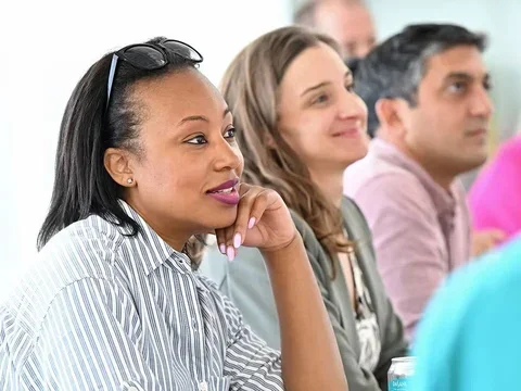   Woman listening attentively during a meeting.