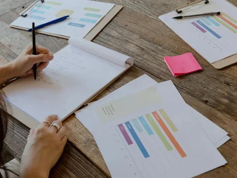 Meeting notes and graphs on table