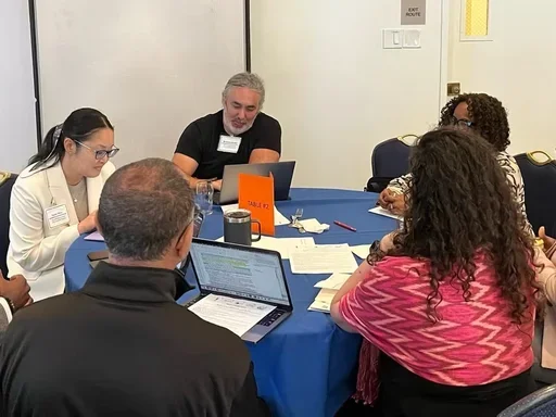 Participants around table at writing seminar
