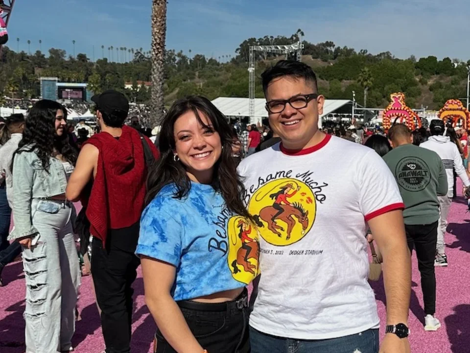 Darwin and Jennifer Gutierrez, DGSOM alumni who fell in loving during medical school, posing at an event