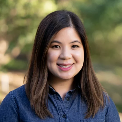 photo of woman in blue button up shirt