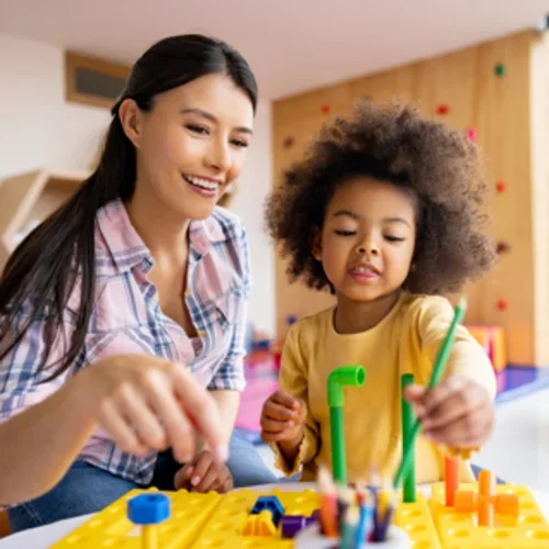 teacher and kid playing