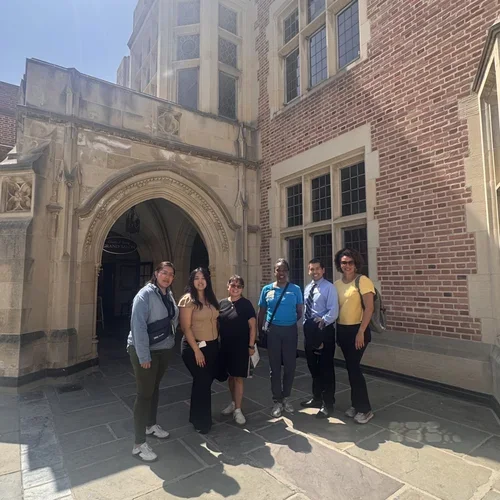 Picture of Program Coordinator group in front of UCLA building