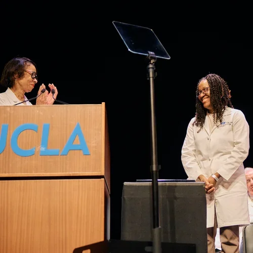 Dr. Kymora Scotland receiving an award during the White Coat Ceremony.