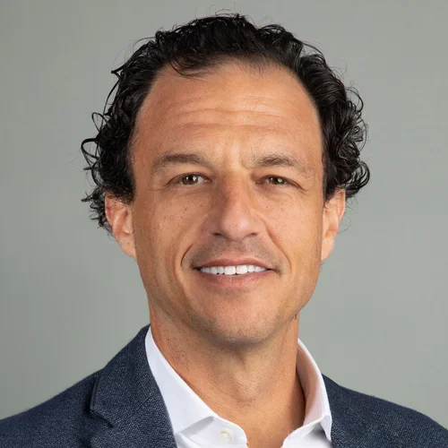 smiling physician wearing suit