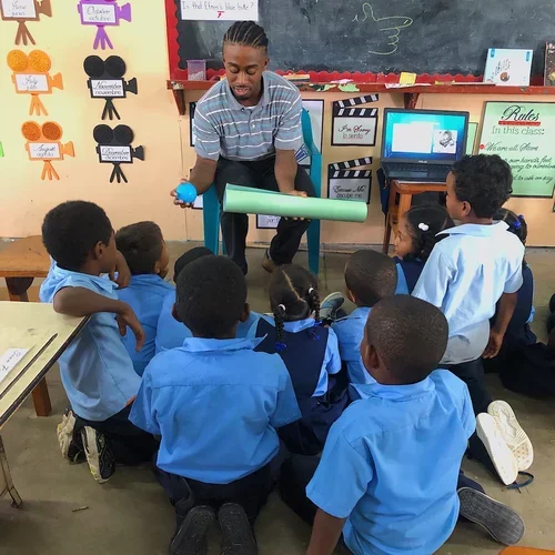 Medical student Samuel Edwards teaching students in Belize with the Peace Corps