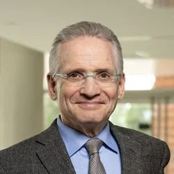 Dean Dubinet standing in office