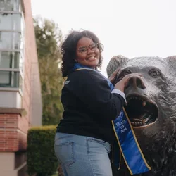 Becoming a doctor: Ky'Tavia Stafford-Carreker with UCLA Bruin bear 