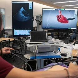 Life of a Medical Resident A medical student using an ultra sound device in a simulation environement