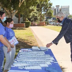 How to Prevent Cancer Via Lifestyle Choices. Person getting info on colon cancer screenings