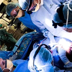 Dr. Justine Lee (far right) and colleagues performing gender-affirming facial feminization surgery at UCLA