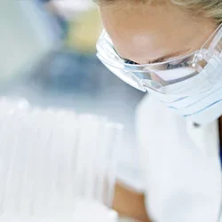 An infectious disease doctor wearing a face mask and goggles 