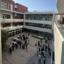A group of new medical students gather for Basecamp in the Geffen Hall courtyard