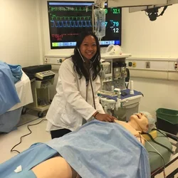 Medical student Melanie Ramirez smiles during a clinical training exercise 