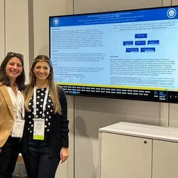 Dr. Canales with a mentee at a presentation
