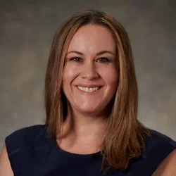 headshot of Dr. Amy Cummings in a black dress