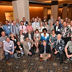 Attending alumni from the Class of 1976 come together for a group photo in celebration of their 50th reunion. 