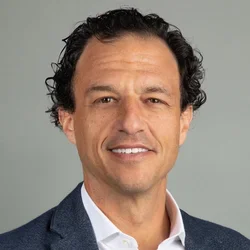 smiling physician wearing suit