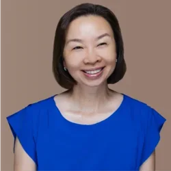 Chief Administrative Officer, Margaret Chu, wearing a blue dress