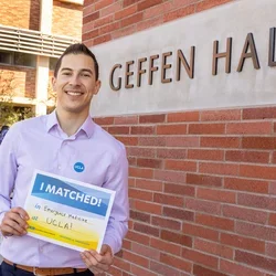 Medical student Rigoberto Perez Hernandez pictured with his residency match results