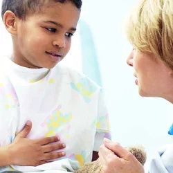A pediatrician with a young patient.