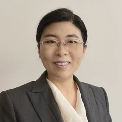 Headshot of Dr. Shuibing Chen in a gray suit with glasses. 