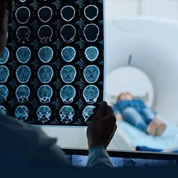 Neurologist and a patient during an imaging scan 