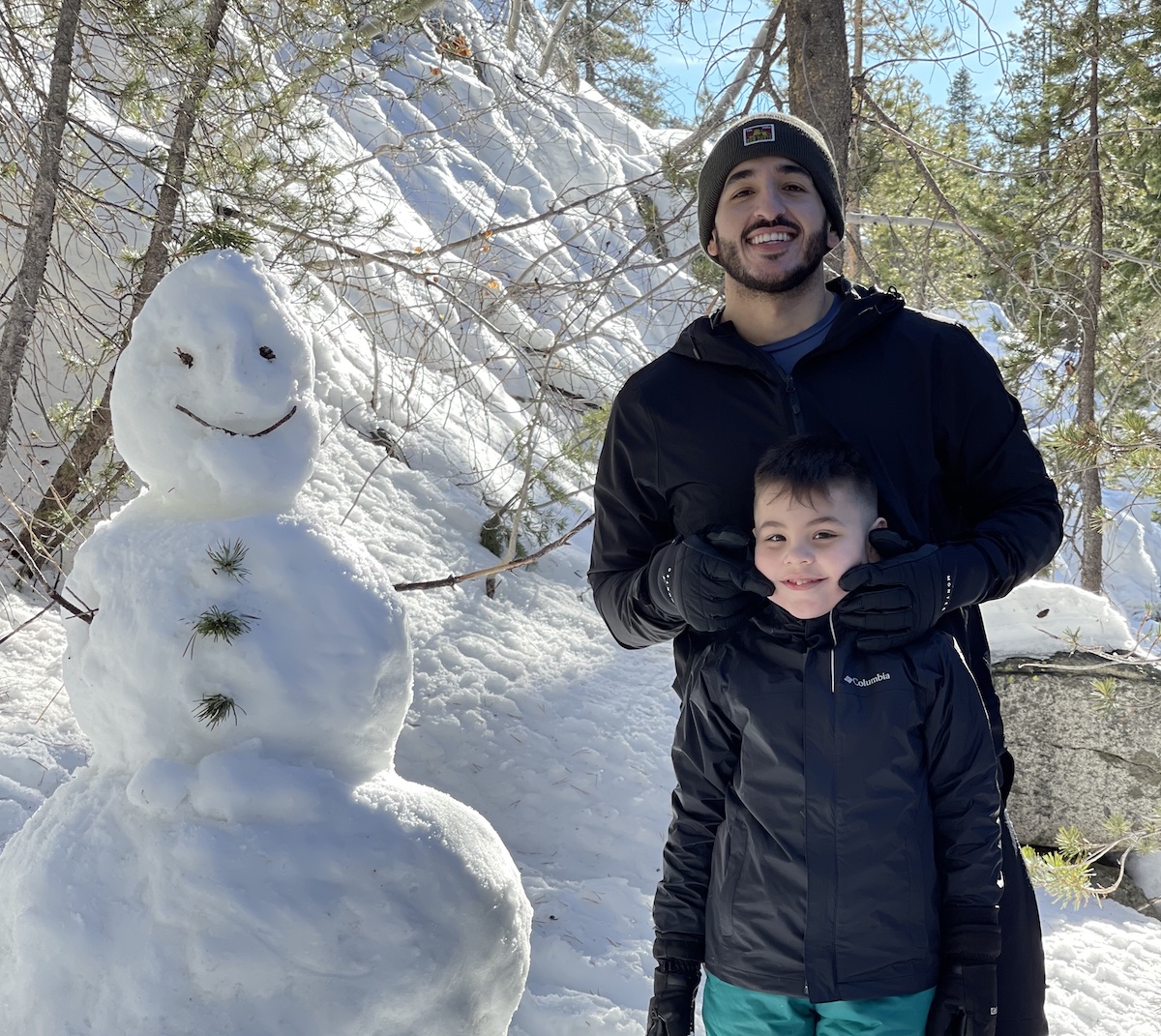 Becoming a Doctor: Gustavo Castellanos and his son build a snowman