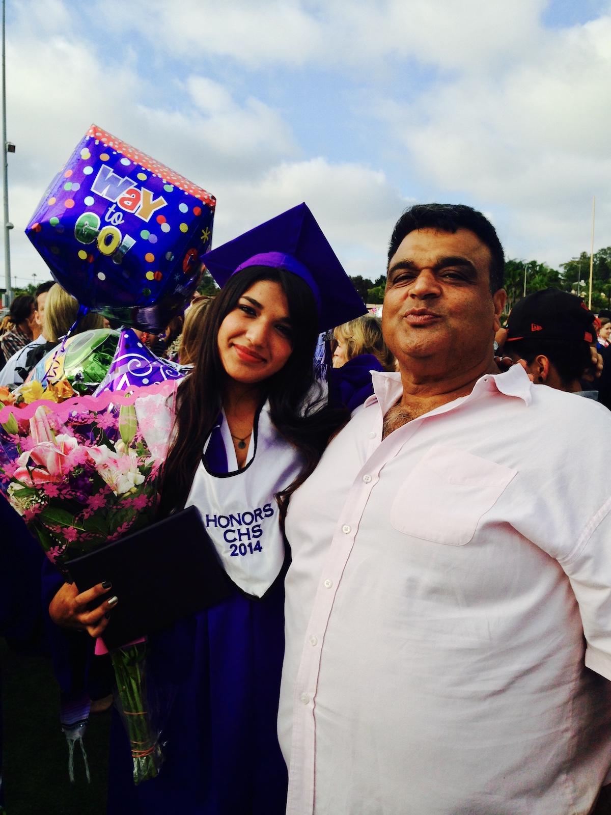 Becoming a Doctor: Yoselin Moetamedi Garcia and her father at her high school graduation